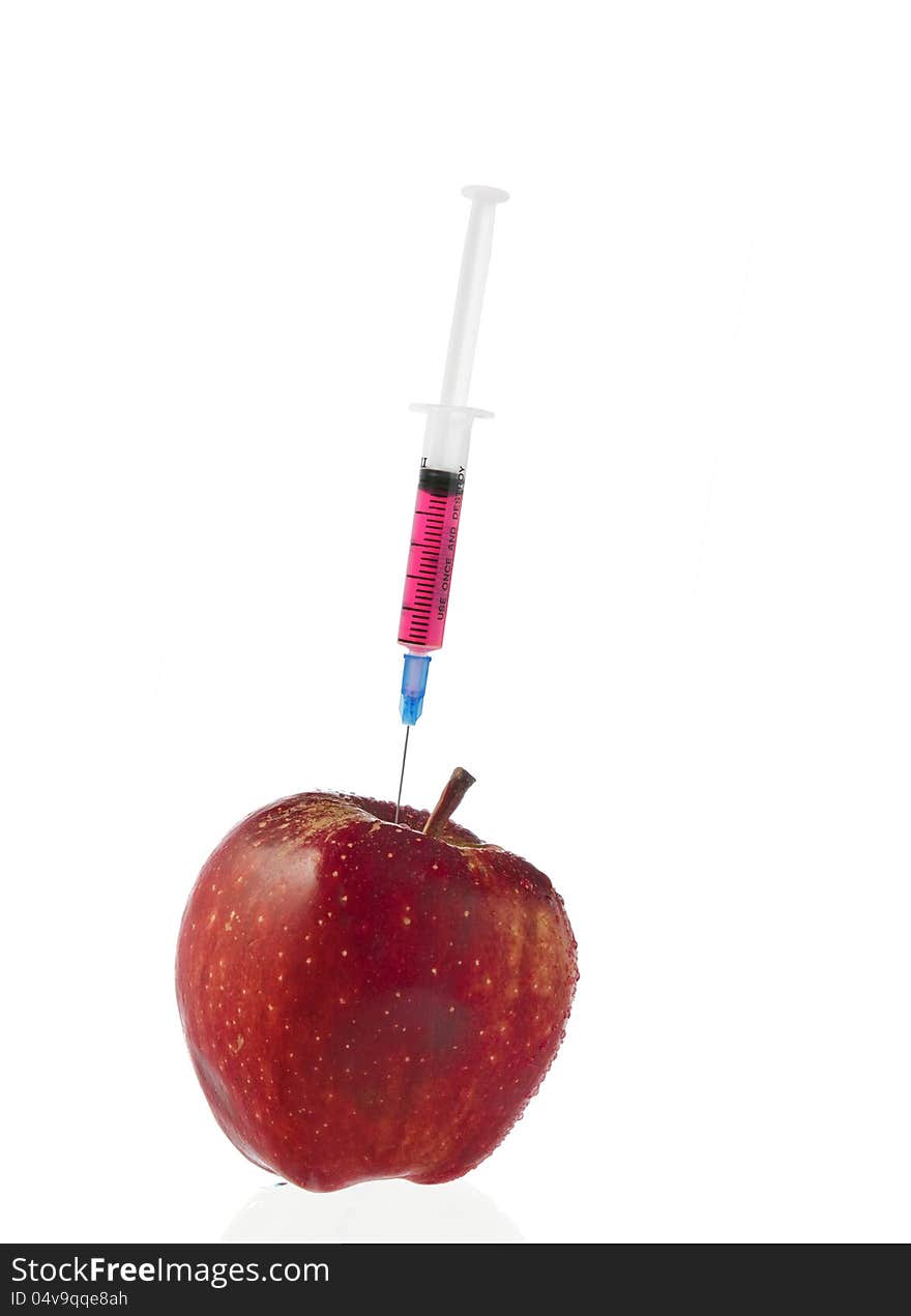 Red apple and syringes isolated on white background