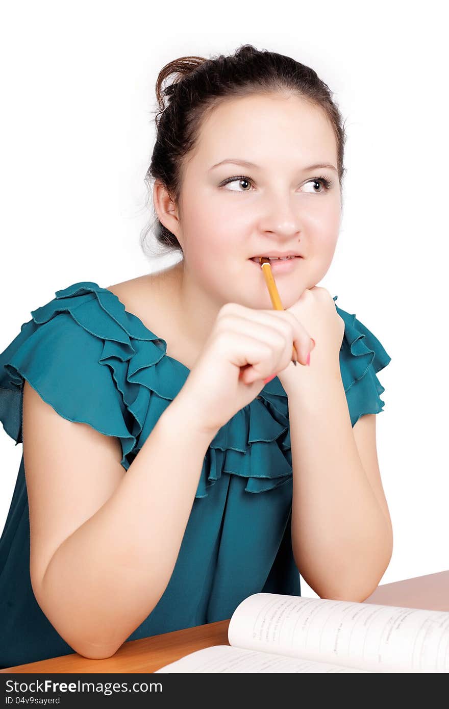 Portrait of a cute brunette schoolgirl learns isolated