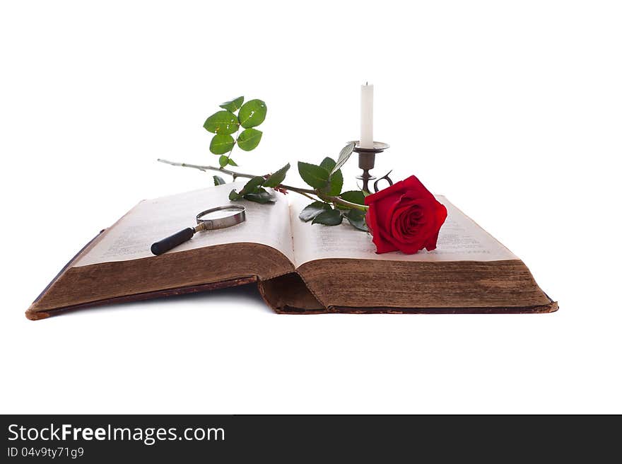 Open Book, Red Rose, Magnifying Glass And Candle