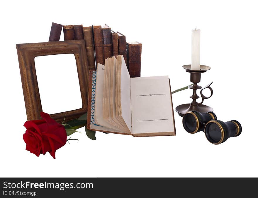 Still life with antique books and picture frames