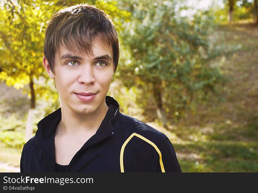 Outdoors portrait of happy young man