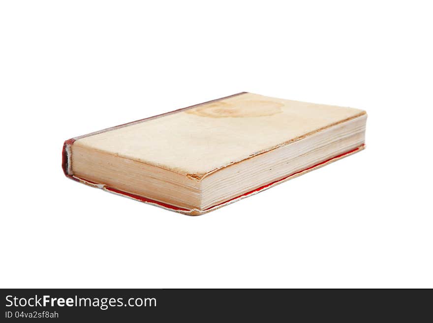 Old book with a spot with cloth cover isolated on white.