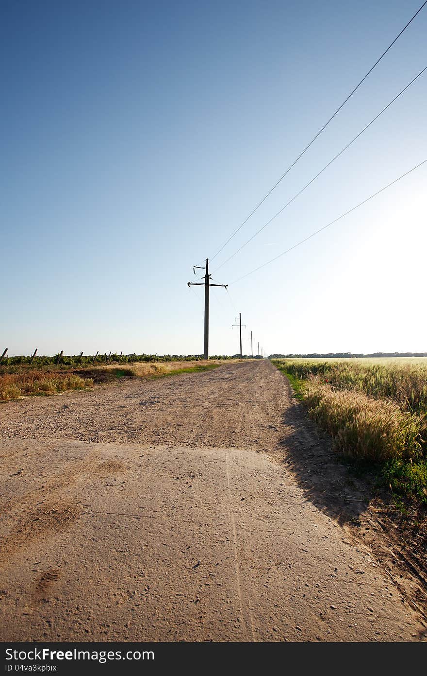 Rural road and the blue sky and grass