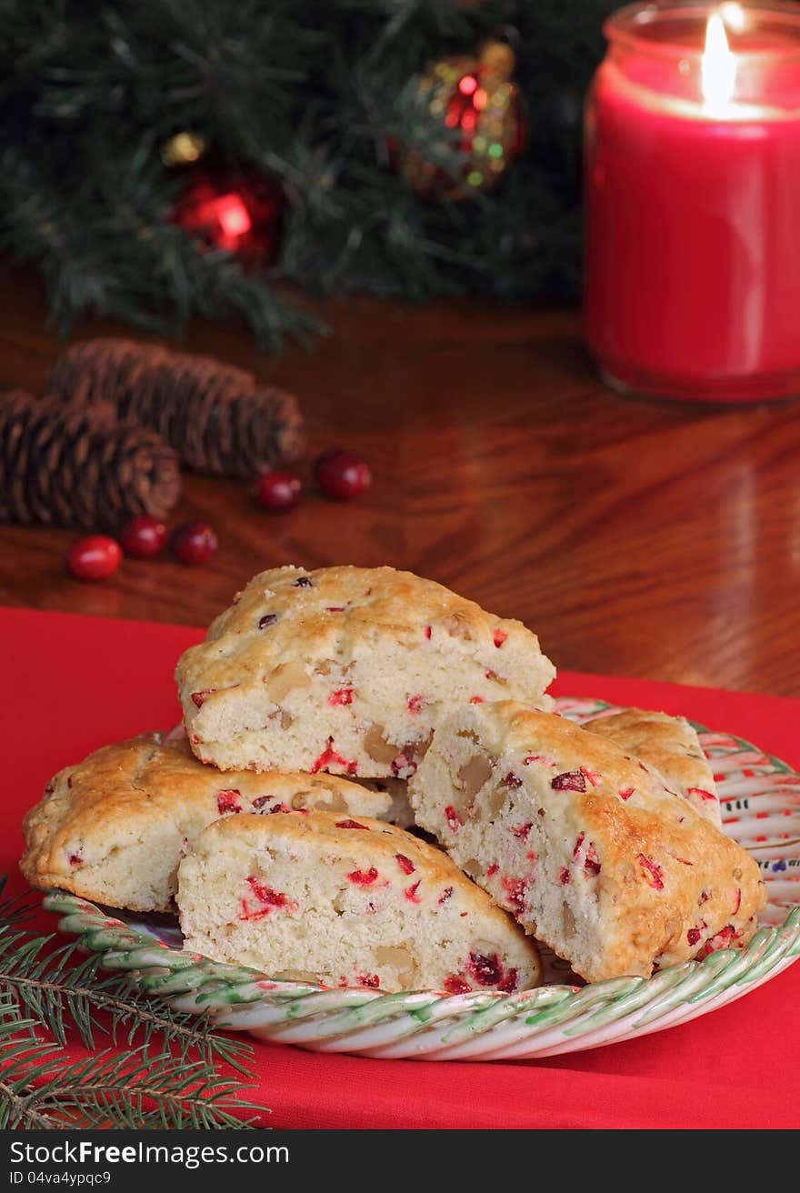 Cranberry nut scones with Christmas decorations in background. Cranberry nut scones with Christmas decorations in background