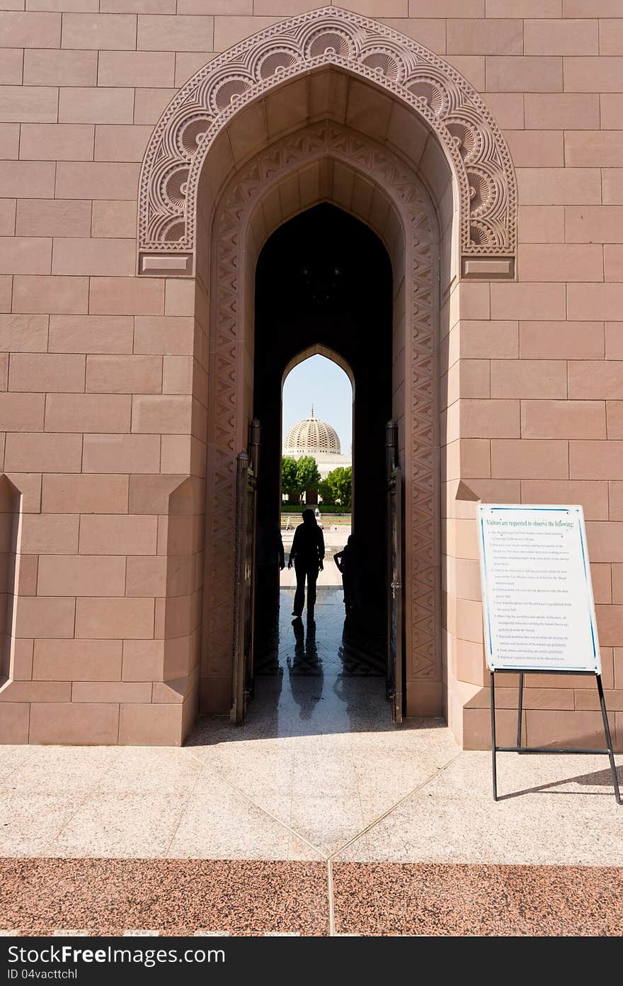 One entrance to the Sultan Qaboos Grand Mosque in Muscat, Oman. Main dome visible through the arch. One entrance to the Sultan Qaboos Grand Mosque in Muscat, Oman. Main dome visible through the arch.