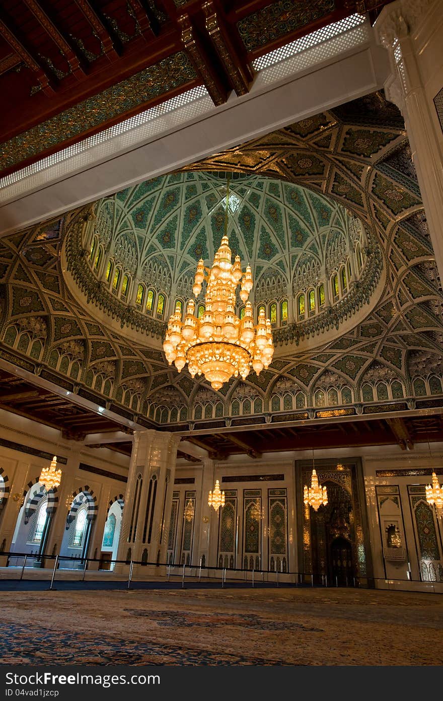 Lavish and beautifully designed inside of the Sultan Qaboos Grand Mosque in Muscat, Oman, also showing the crystal chandeliers. Lavish and beautifully designed inside of the Sultan Qaboos Grand Mosque in Muscat, Oman, also showing the crystal chandeliers.