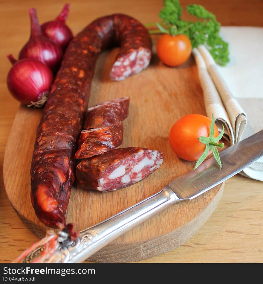 Sausage on a wooden cutting board