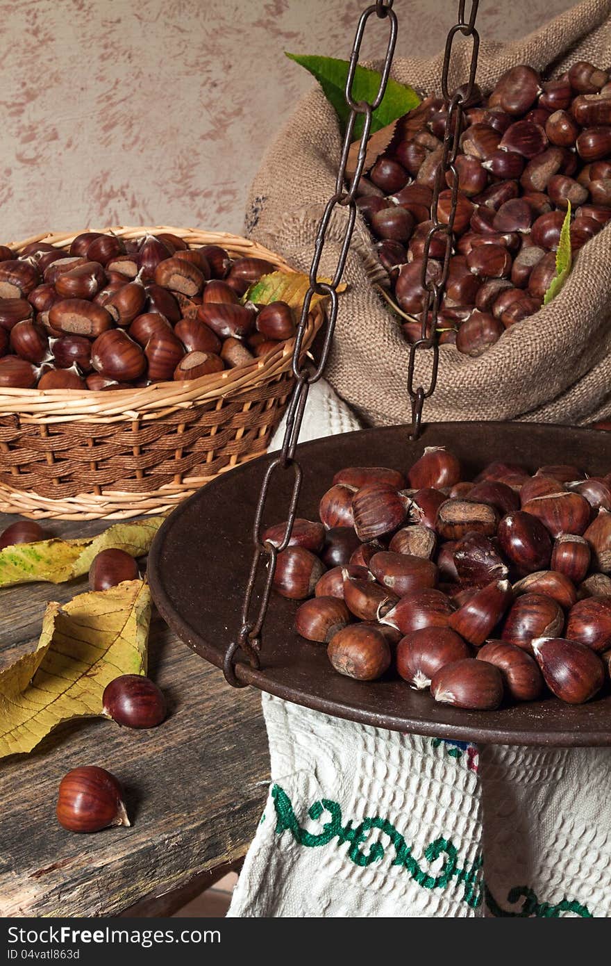 Still life with chestnuts and balance ancient