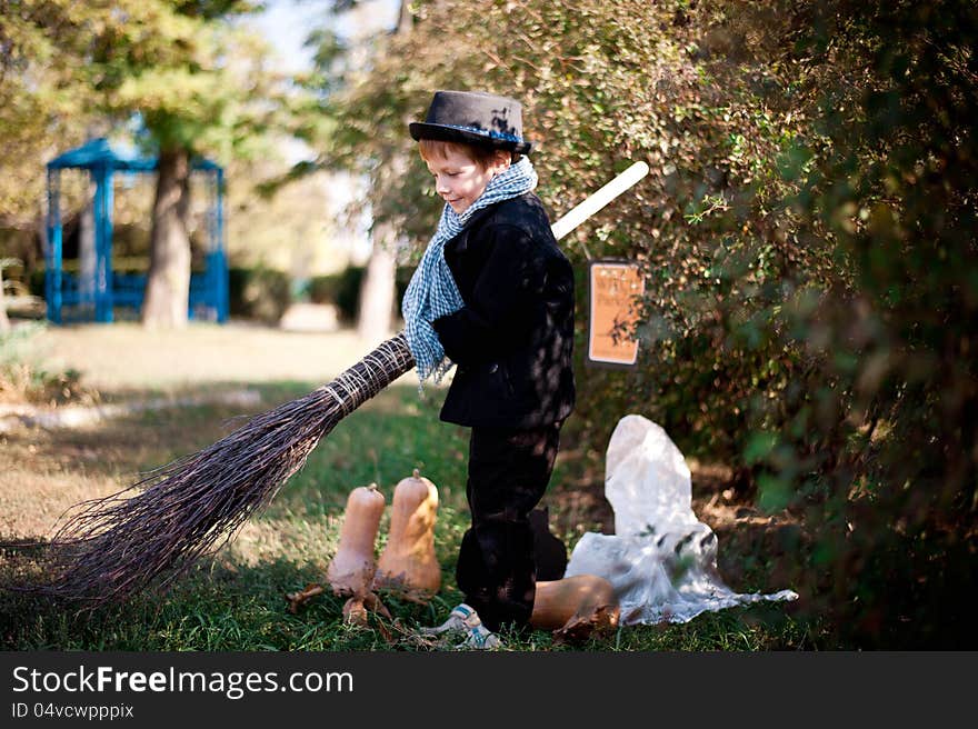 The nature boy in black hat and coat celebrates Halloween