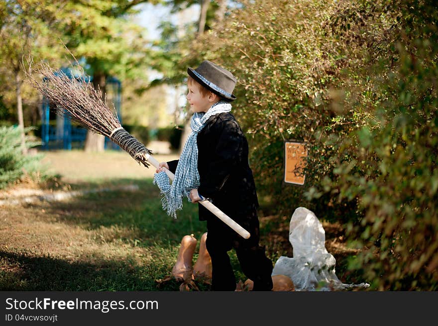 The nature boy in black hat and coat celebrates Halloween