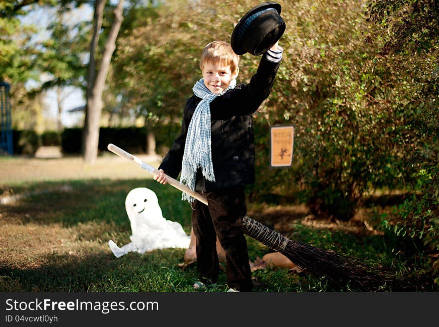 The nature boy in black hat and coat celebrates Halloween