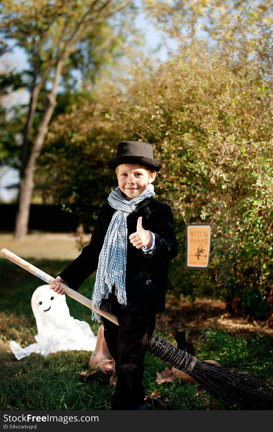 The nature boy in black hat and coat celebrates Halloween