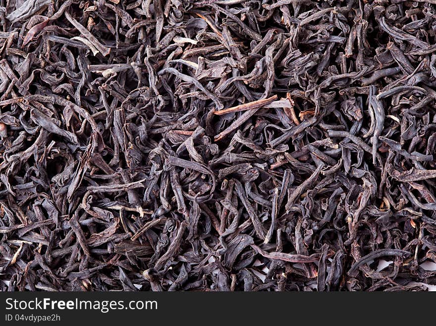 Dried leaves of black tea, a delicious strong drink.