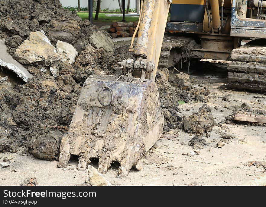 Closeup image of excavator parking on worksite. Closeup image of excavator parking on worksite