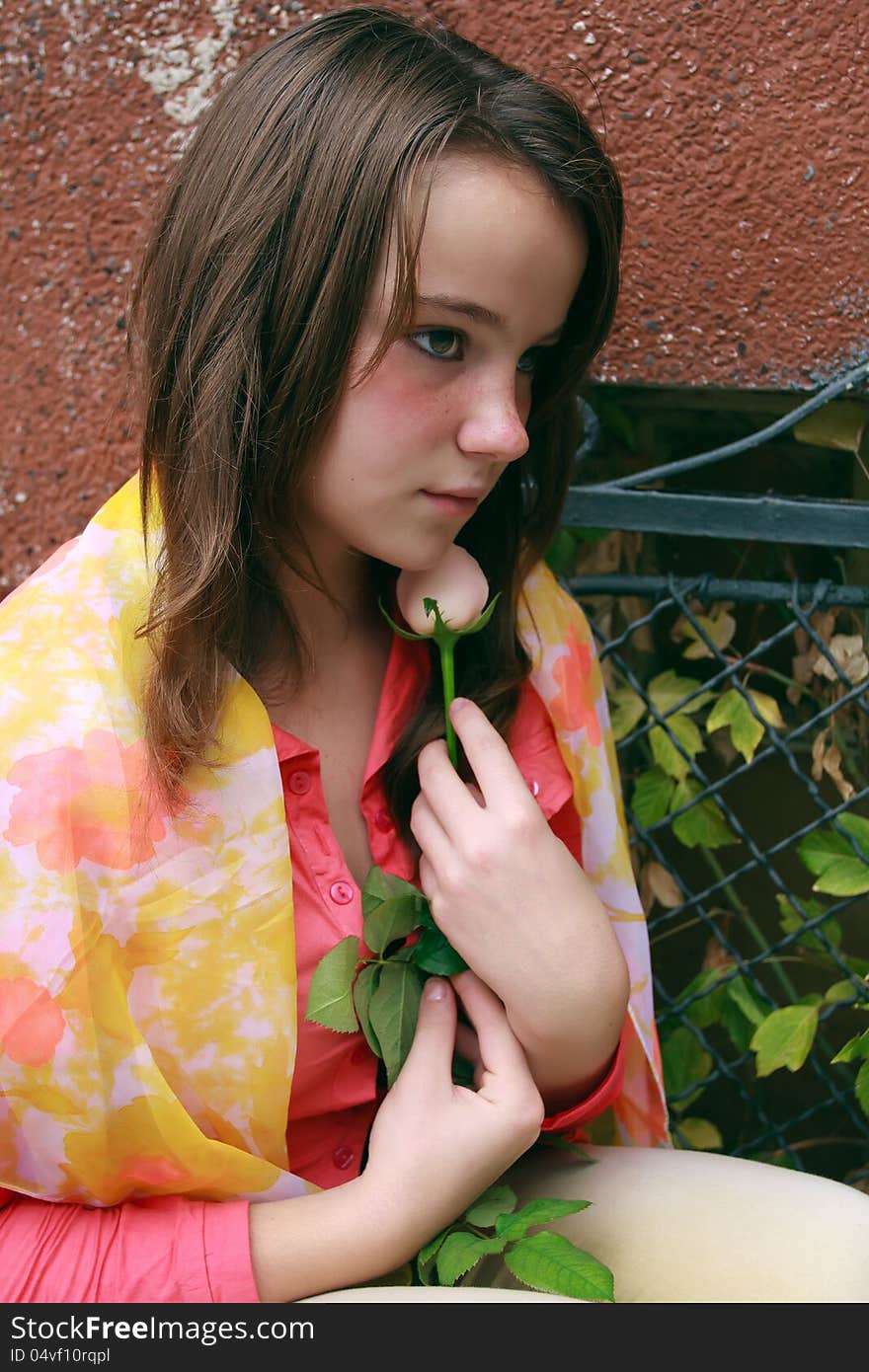 Beautiful young girl against a wall. Beautiful young girl against a wall