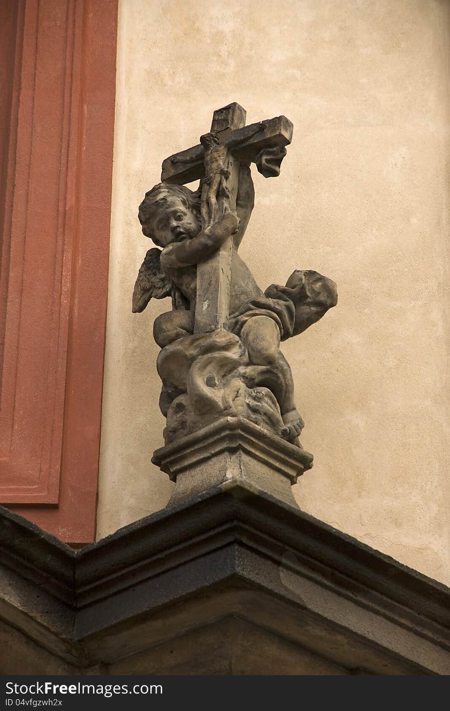 Statue of a child with holy cross. Statue of a child with holy cross