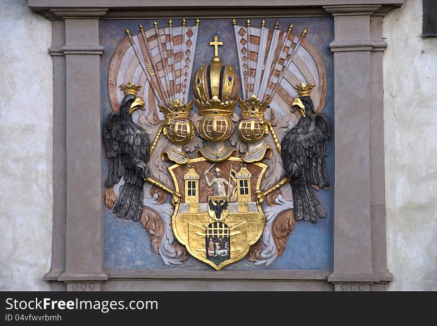 Exterior decoration of the house, coat of arms with the knight and two black eagles