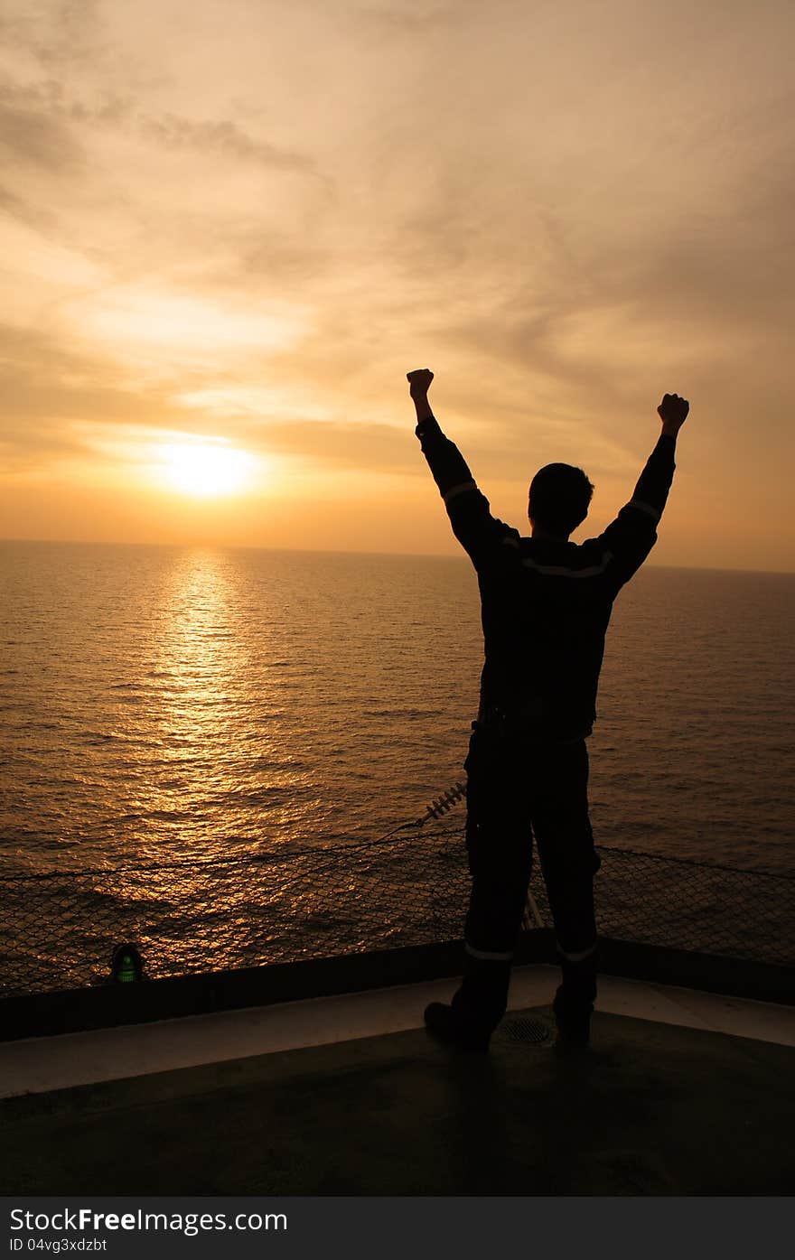 Silhouette Image of Man Raising His Hands