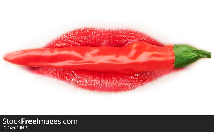 Piquant red pepper in a woman s lips.