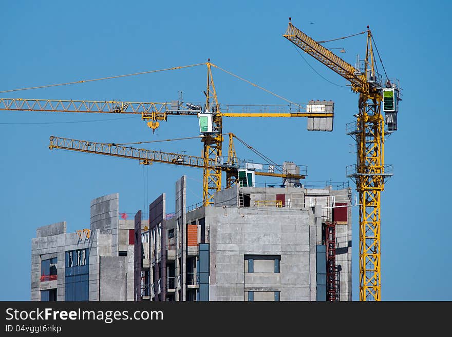 Buildings under construction with cranes