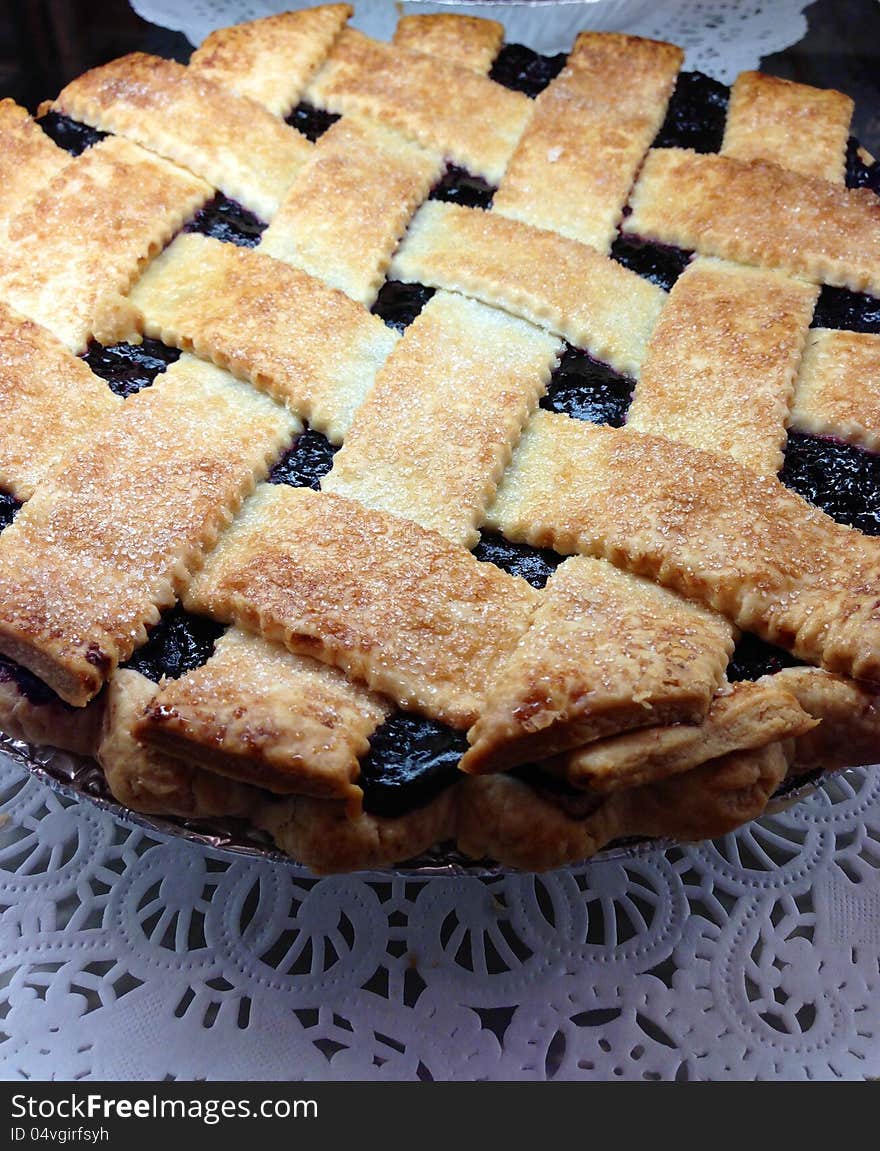 Home made black berry blue berry pie basket weave criss cross pastry top