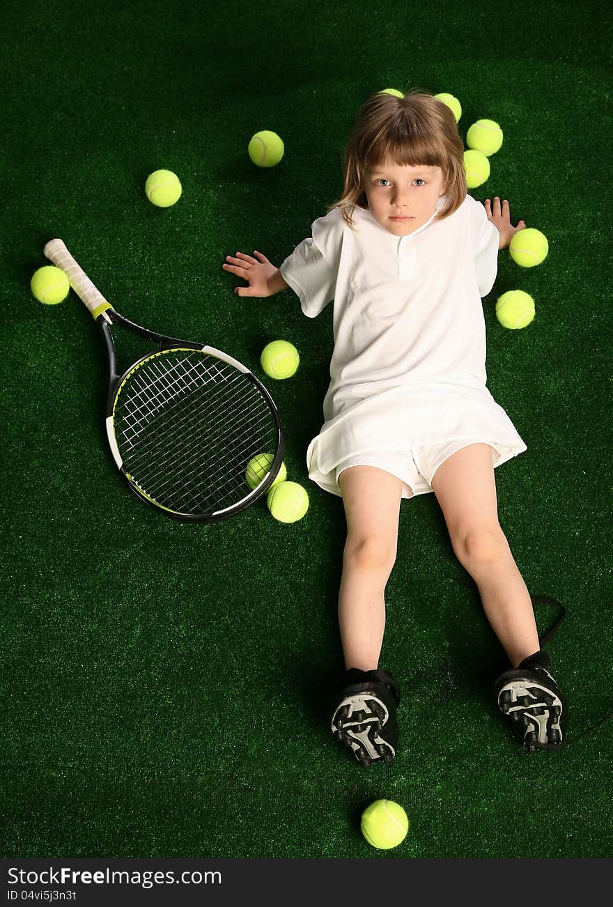 Girl with tennis balls on green background. Girl with tennis balls on green background