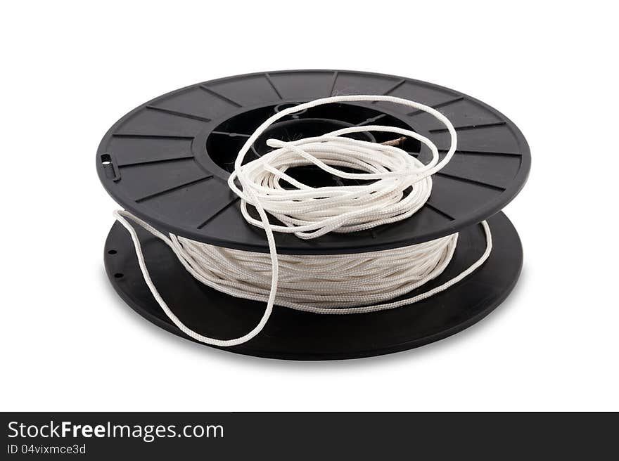 Photo of black coil with white rope on a white background. Photo of black coil with white rope on a white background