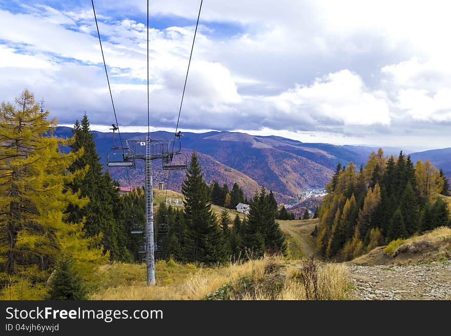 Chair lift in the forest in autumn