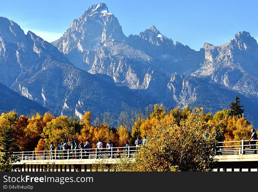 A group of tourists sightseeing in The Grand Tetons. A group of tourists sightseeing in The Grand Tetons.