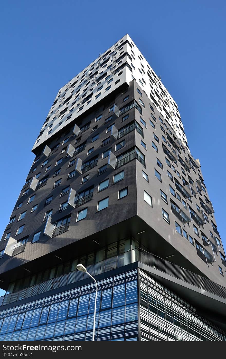 This image presents a modern and very beautiful apartment building in Groningen, Holland. This image presents a modern and very beautiful apartment building in Groningen, Holland