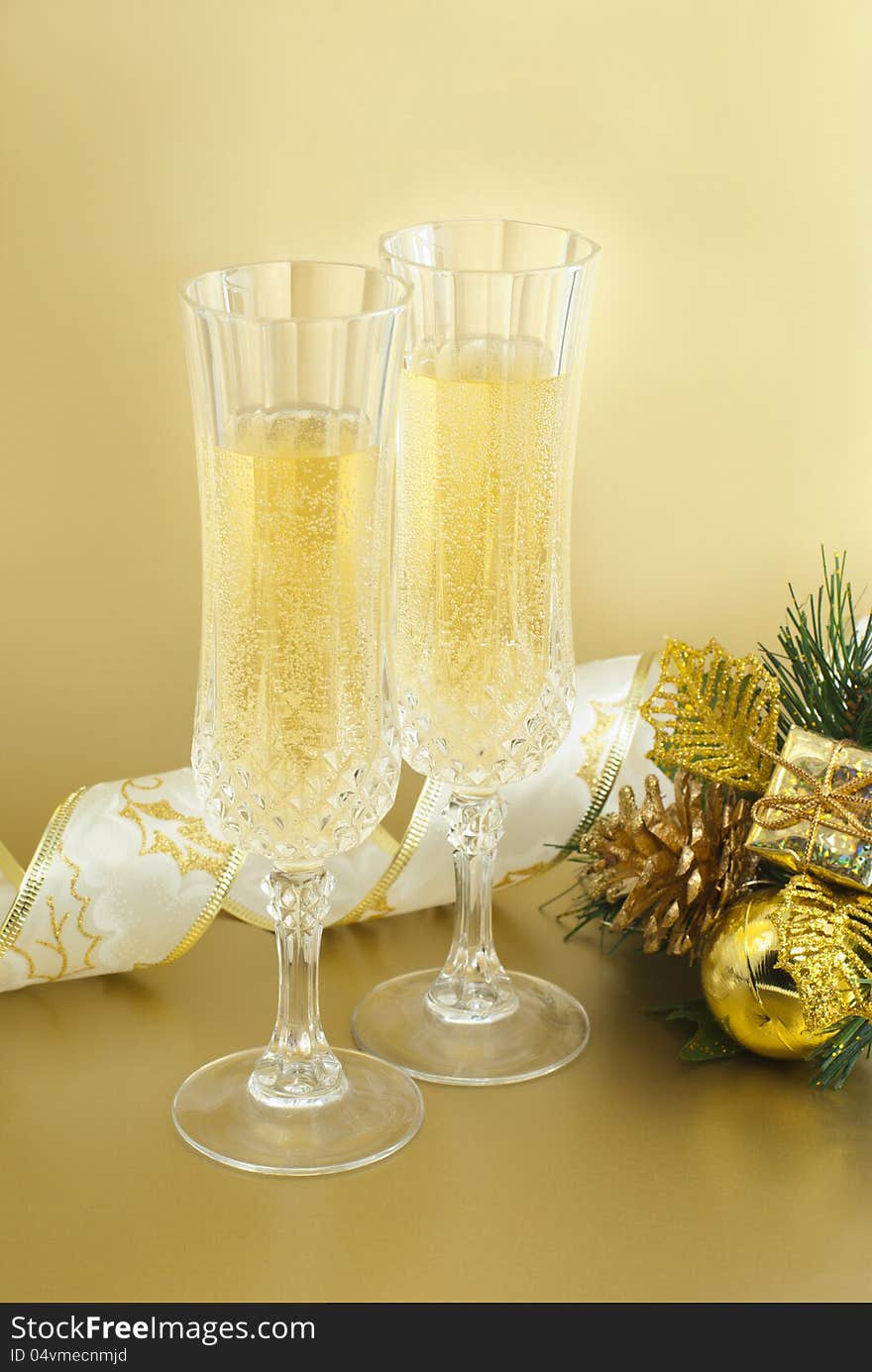 Christmas glasses with champagne and christmas decorations. Christmas glasses with champagne and christmas decorations.