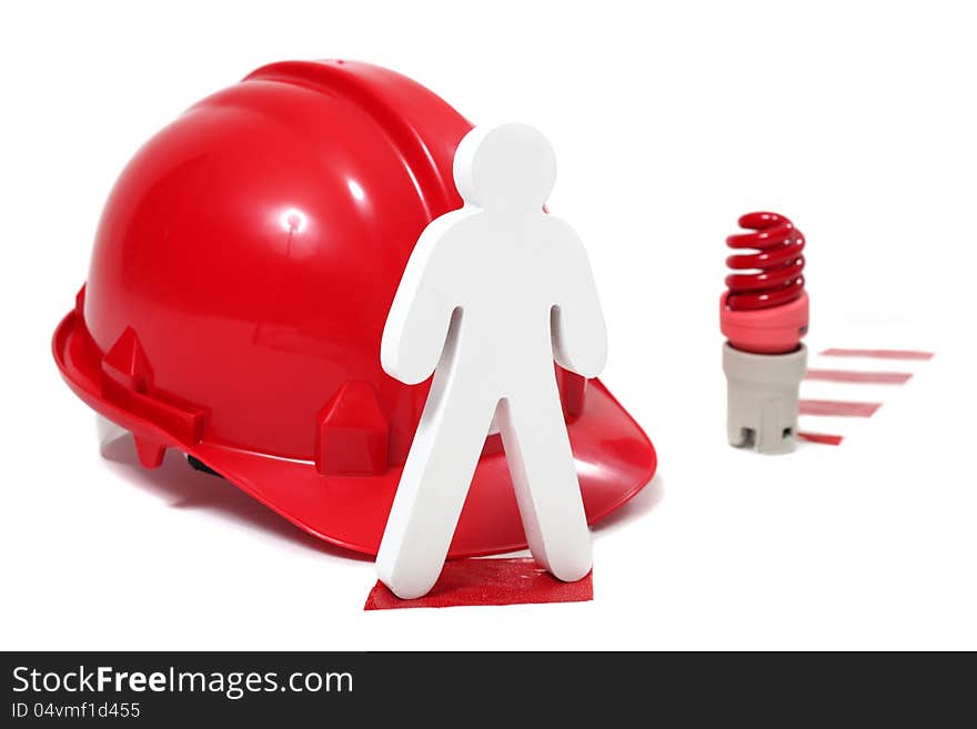 Wooden figure standing next to warning light,hard hat and chevron. Wooden figure standing next to warning light,hard hat and chevron