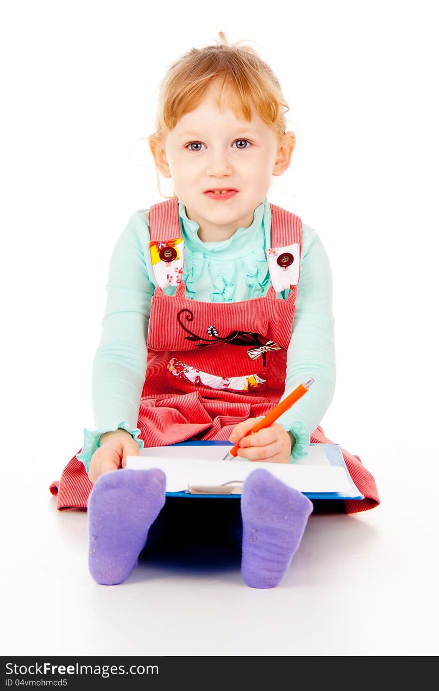 A little girl sits and paints isolated on white background