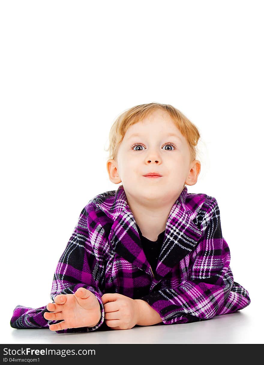 A little girl in a dress, a look of surprise isolated on white background