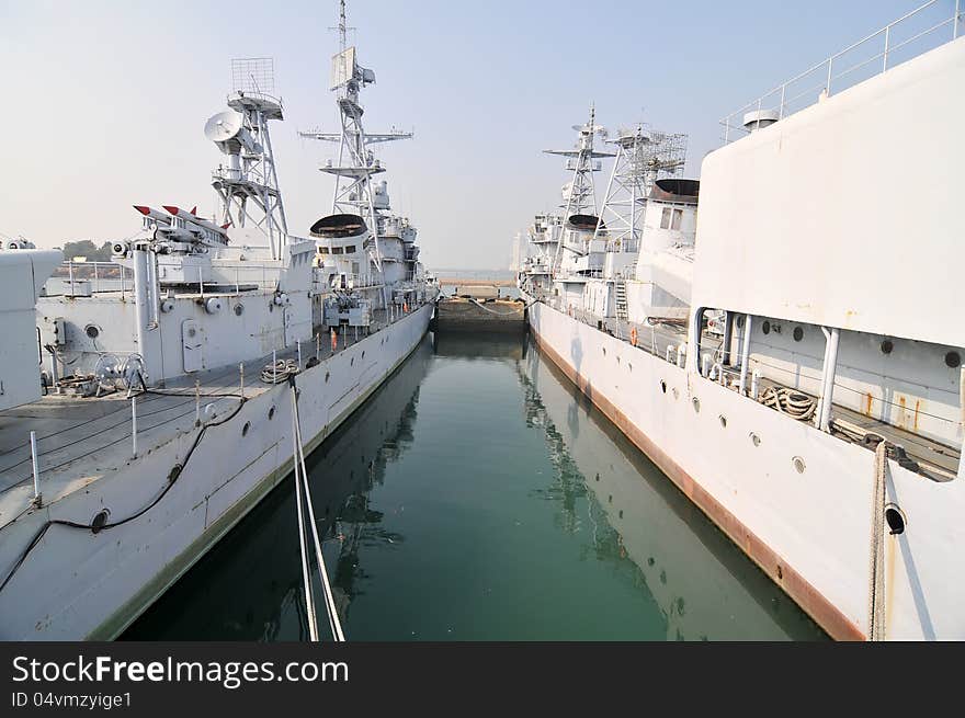 Two warships docked at the pier，which taken in the Chinese Navy Museum. Two warships docked at the pier，which taken in the Chinese Navy Museum