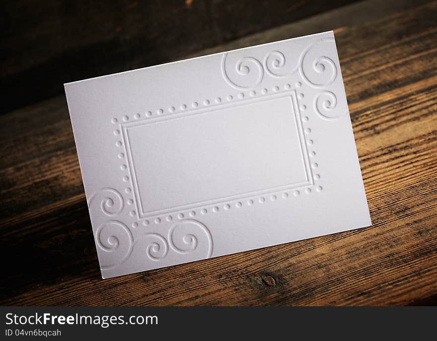 Blank Invitation on a old wooden background