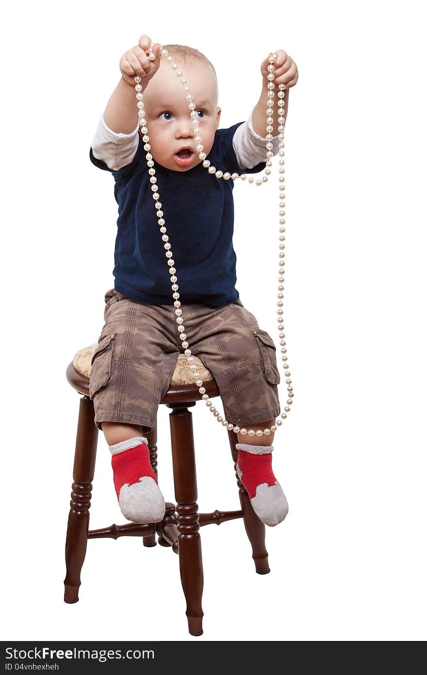 Boy playing pearl necklace