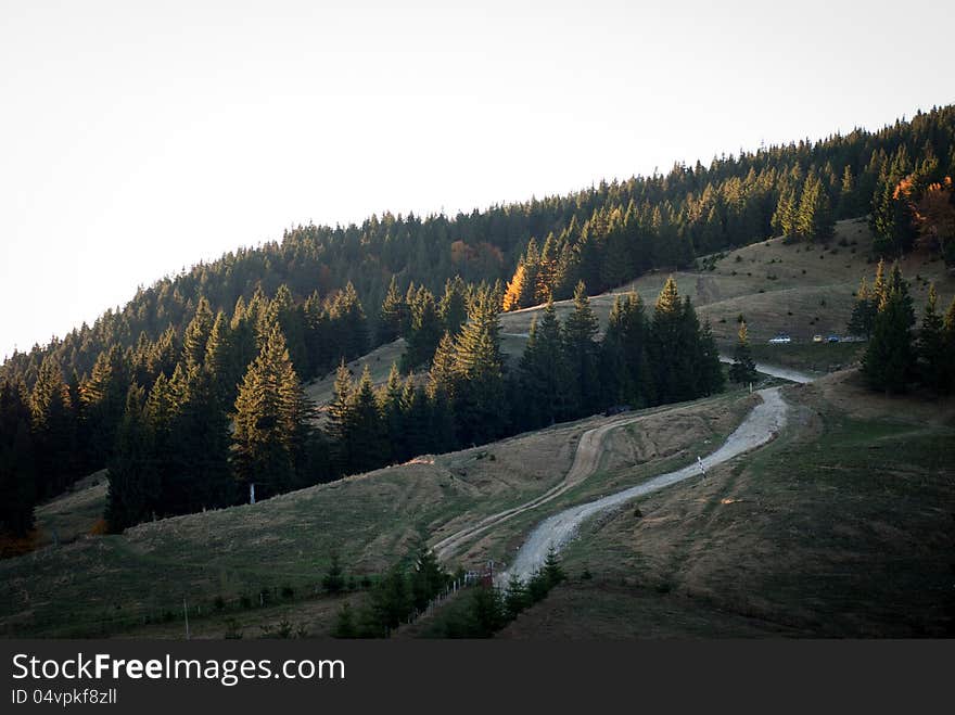 An old forest road meandering through the mountain. An old forest road meandering through the mountain