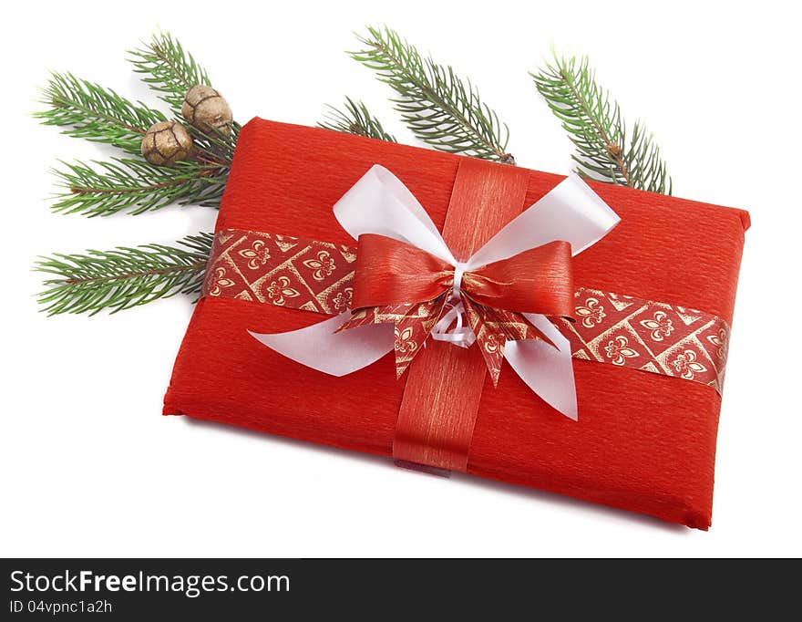 Christmas Red Present with white and red ribbon and Christmas branch. Christmas Red Present with white and red ribbon and Christmas branch