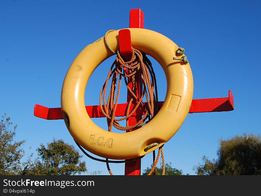 Rubber survival ring, blue sky in background. Rubber survival ring, blue sky in background