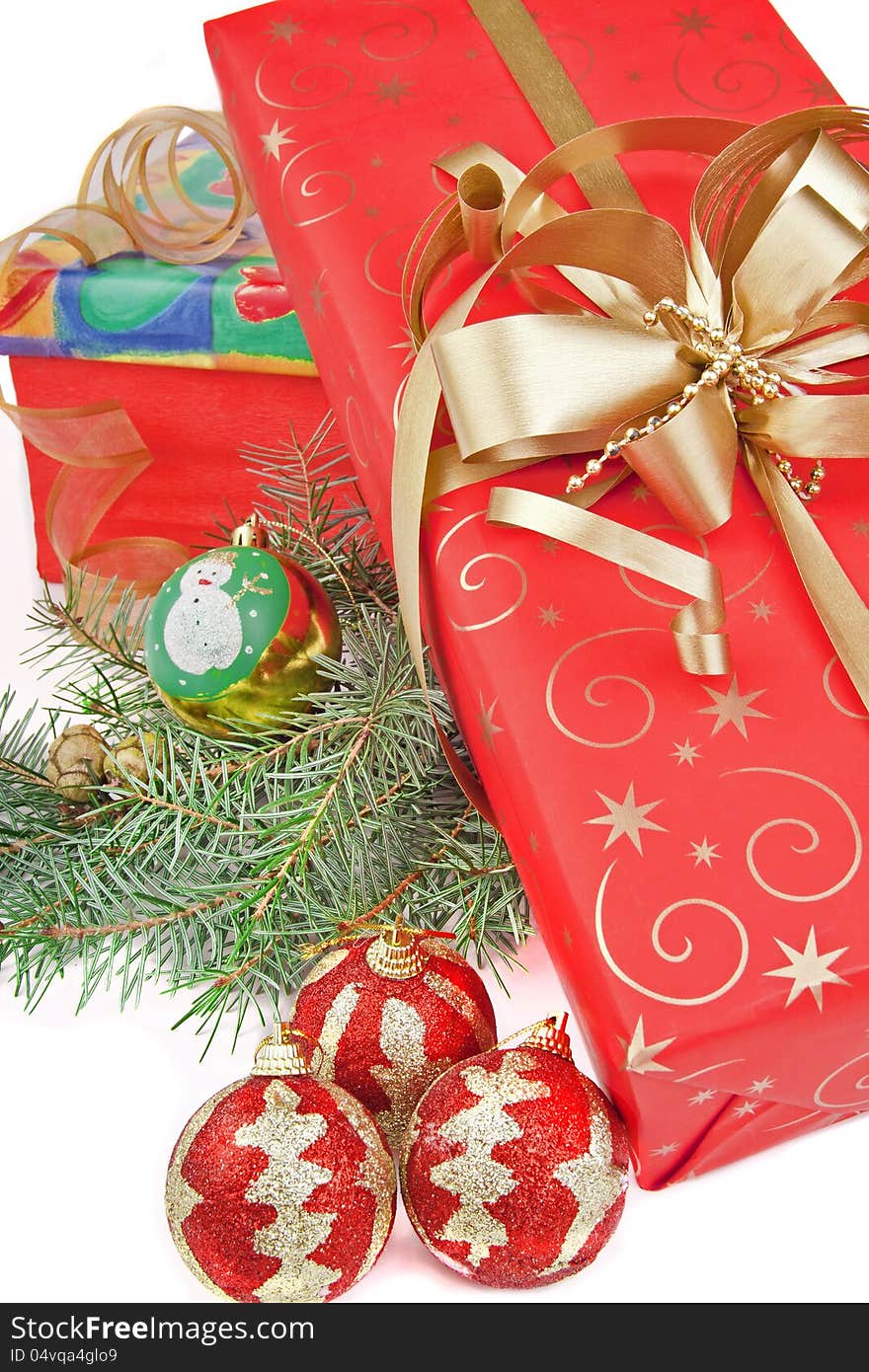 Christmas presents with golden ribbon and Christmas branch