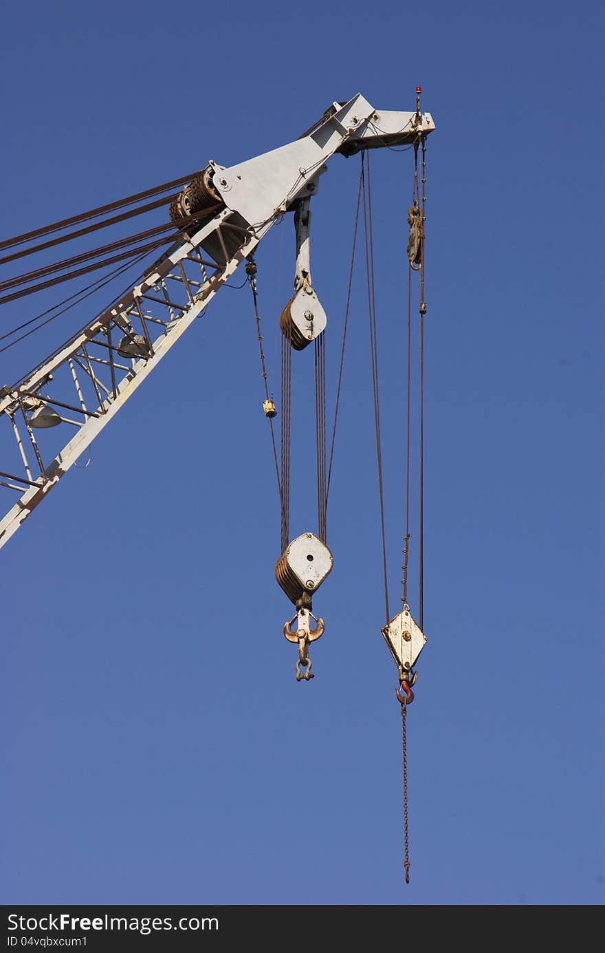 The block and tackle lifting cables of a crane at the Morehead City Docks