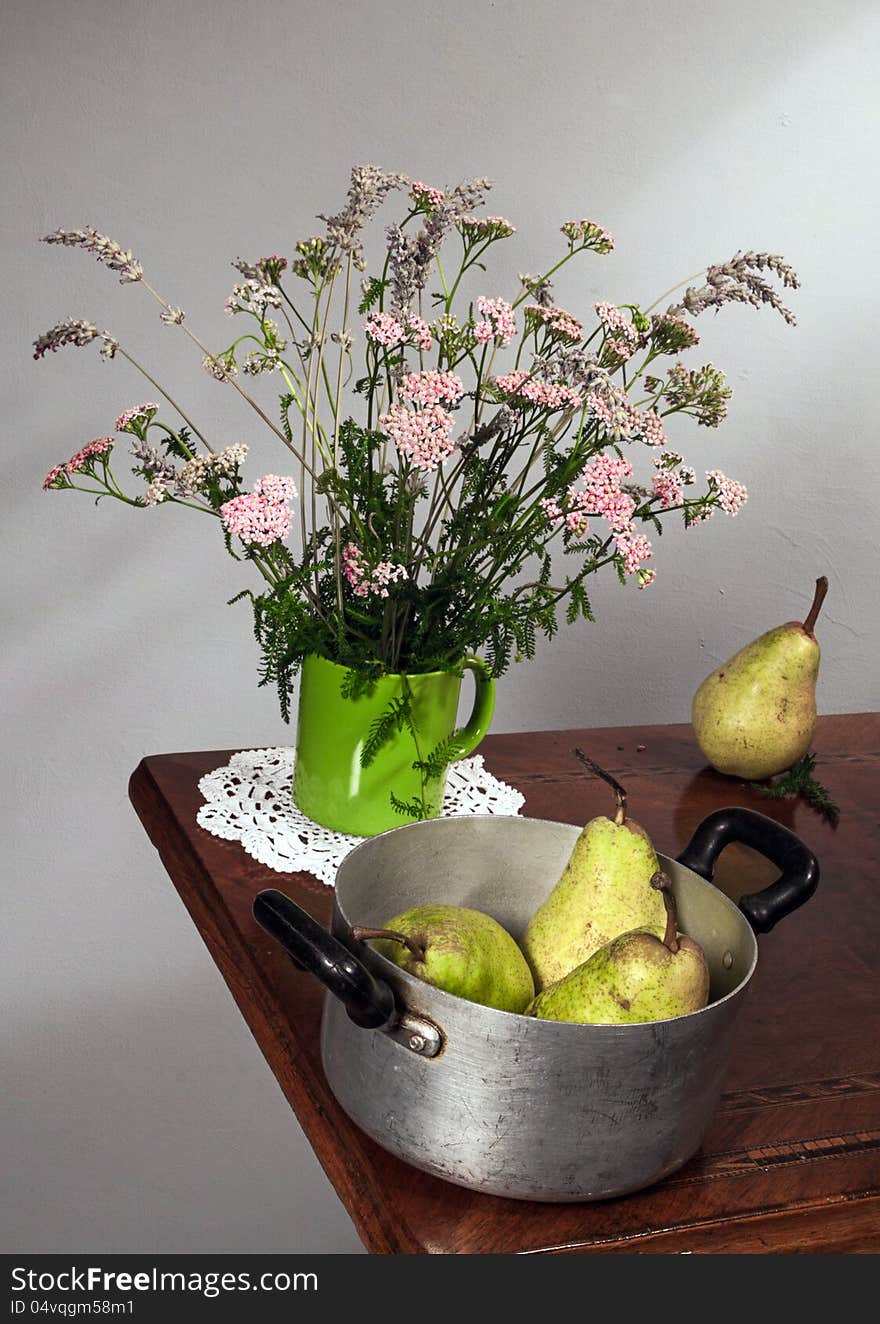 Autumn still life with apple and flowers