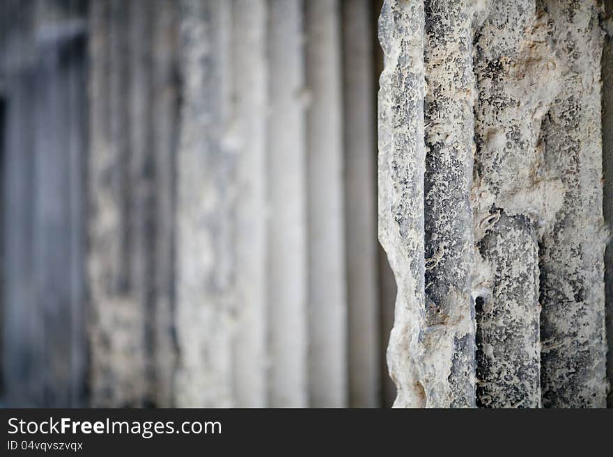 Antique stone column background with blurred perspective