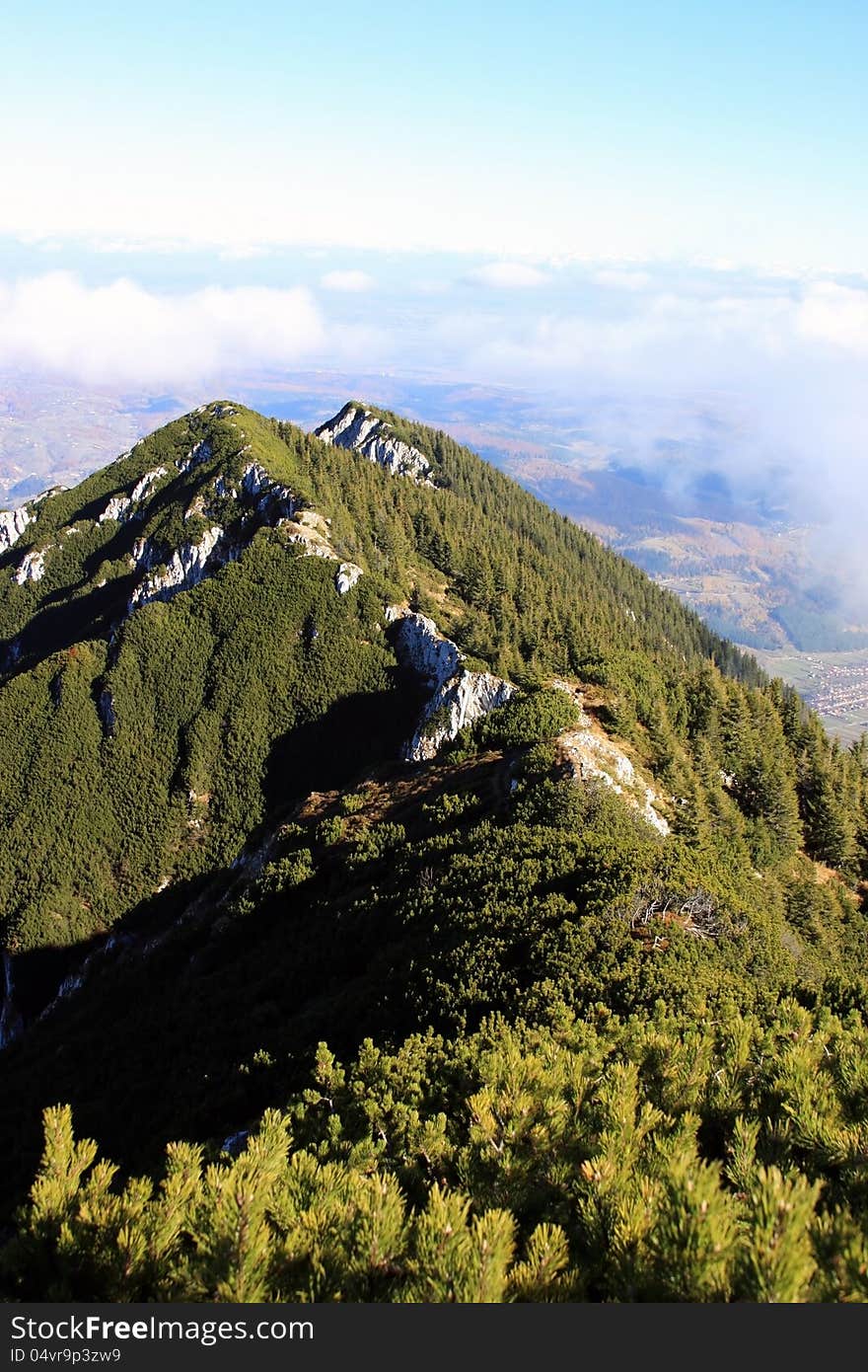 This image present the crest of Piatra Craiului mountain as seen from it`s highest point, at 2244 m. This image present the crest of Piatra Craiului mountain as seen from it`s highest point, at 2244 m.