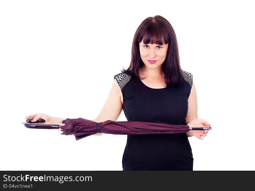 Beautiful girl standing with closed umbrella isolated on white background