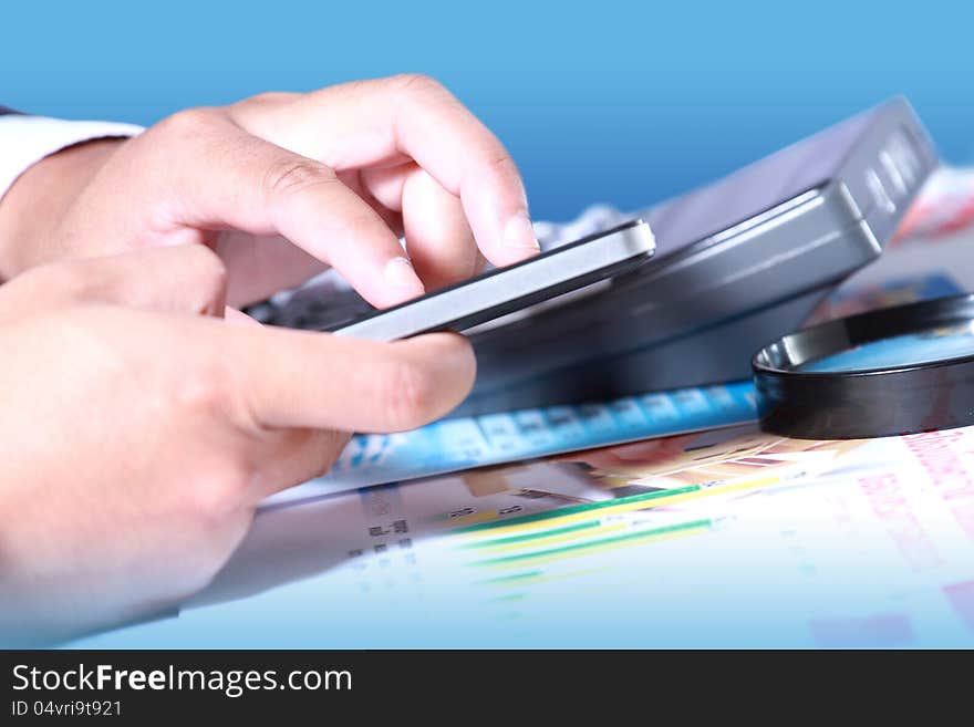 Businessman hand using smart phone on the desk