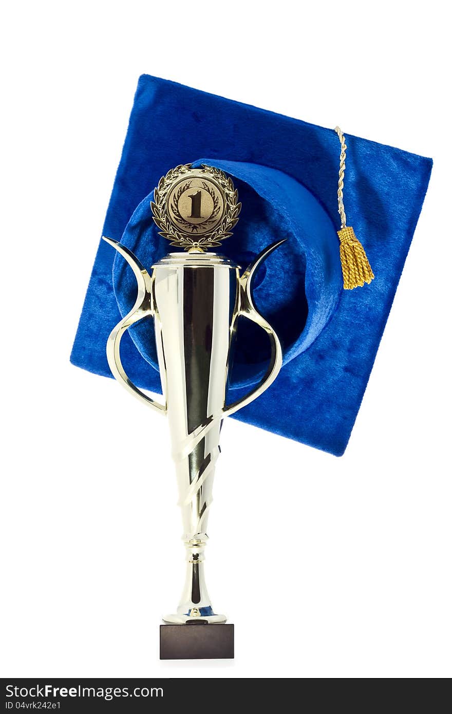 Graduation cap & the 1st winner cup on white. Graduation cap & the 1st winner cup on white.