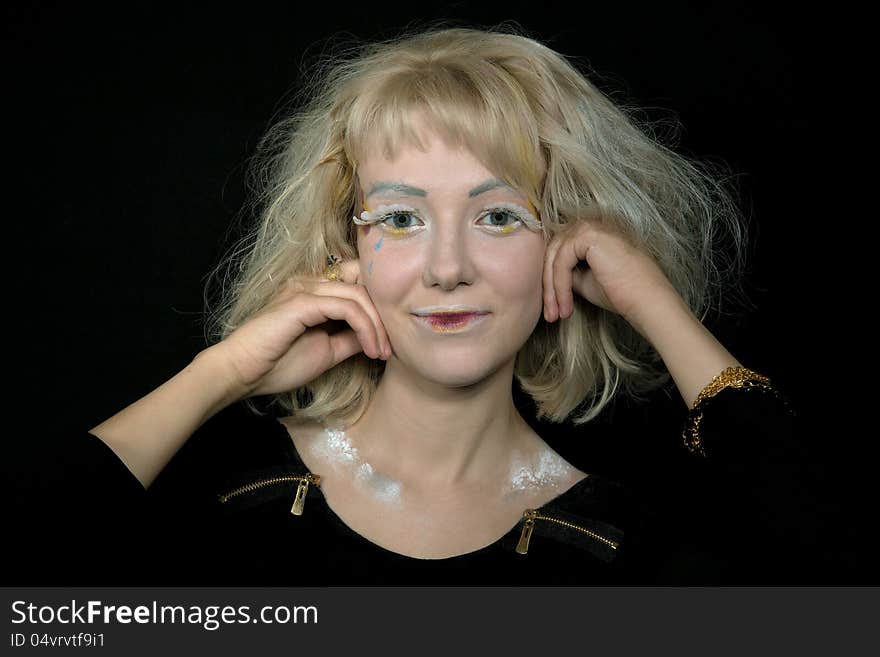 Girl with light hair in a make-up of an angel. Girl with light hair in a make-up of an angel