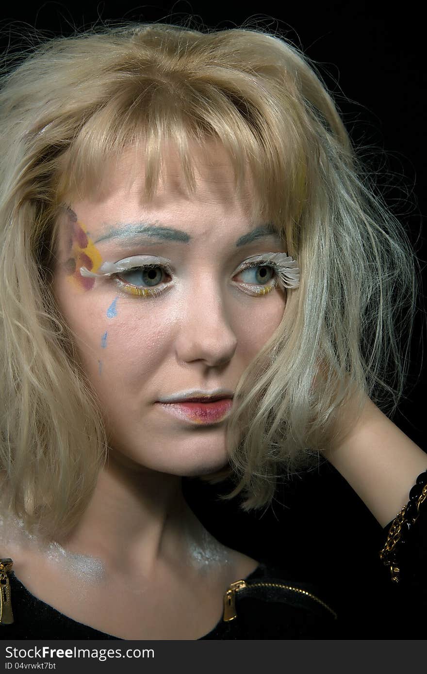 Girl with light hair in a make-up of an angel. Girl with light hair in a make-up of an angel